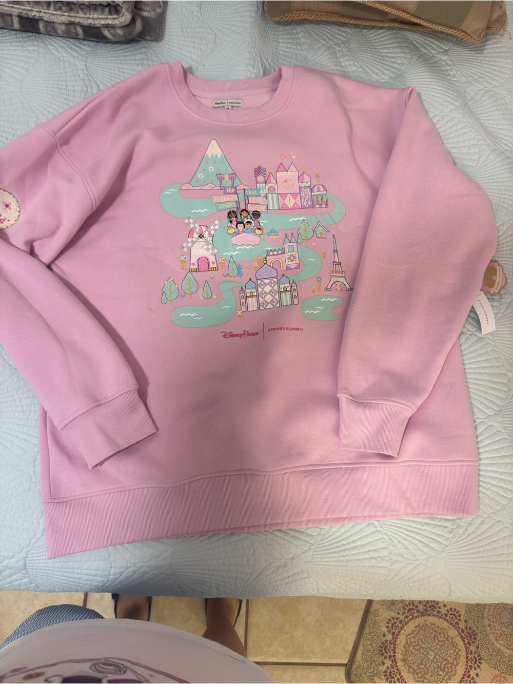 It’s a Small World” long-sleeve sweatshirt by Stoney Clover